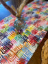 Heart menorahs Hanukkah table runner on a set holiday table.