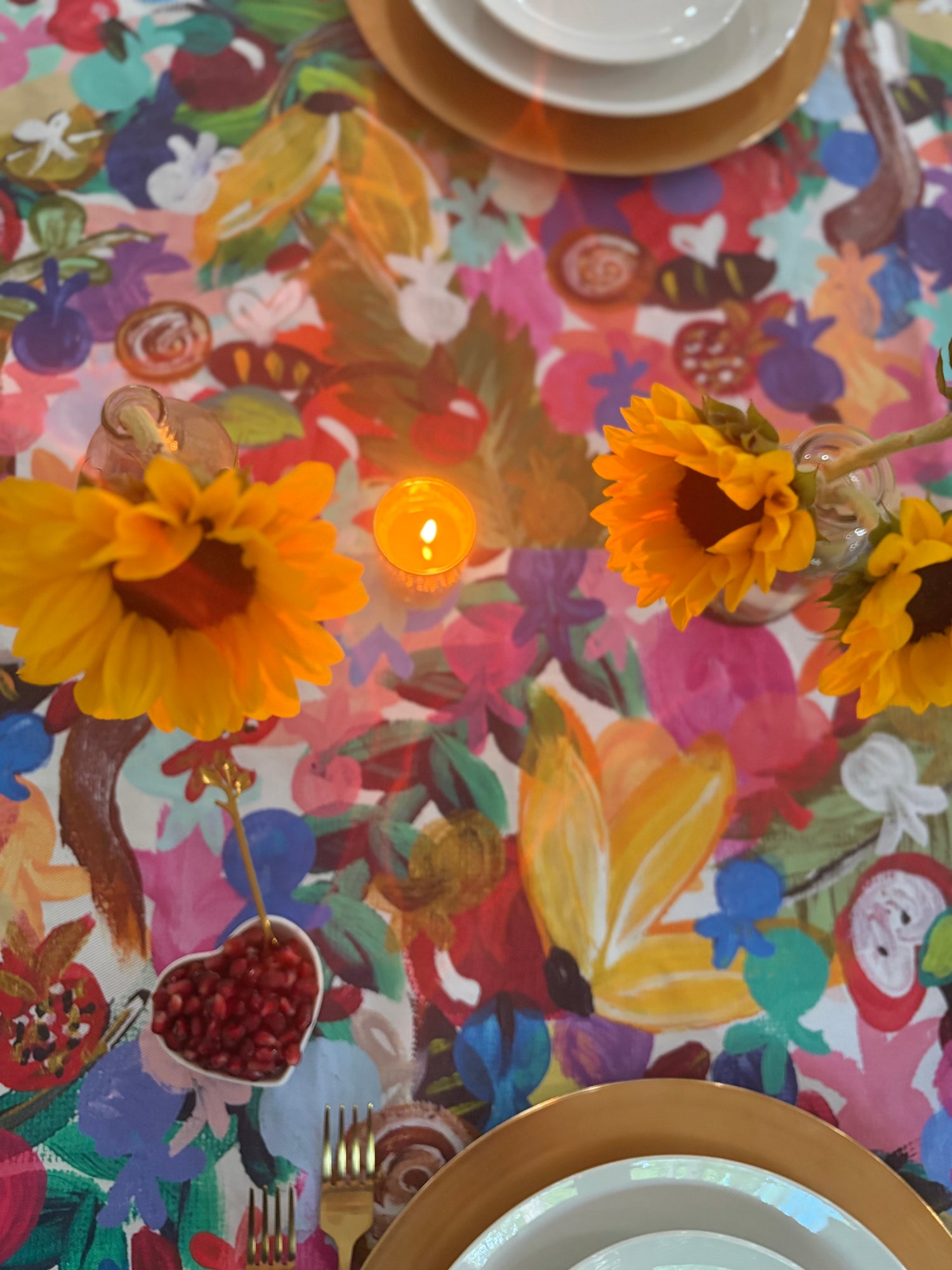 Colorful Jewish tablecloth with apples honey shofars and pomegranates