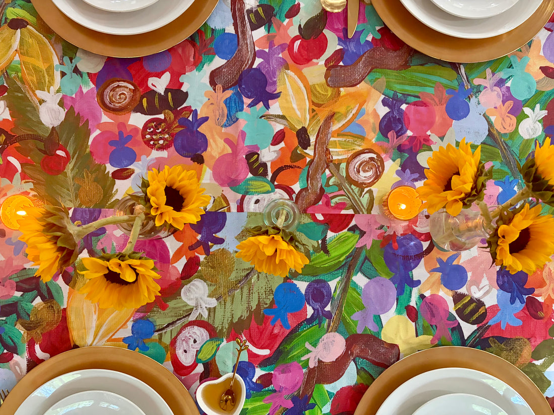 The 613 Tablecloth styled for a colorful Rosh Hashanah table
