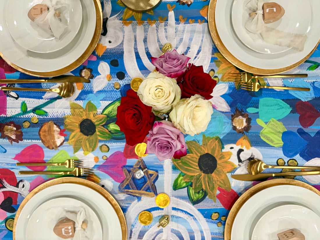 Hanukkah Garden Party Tablecloth on a set holiday table.