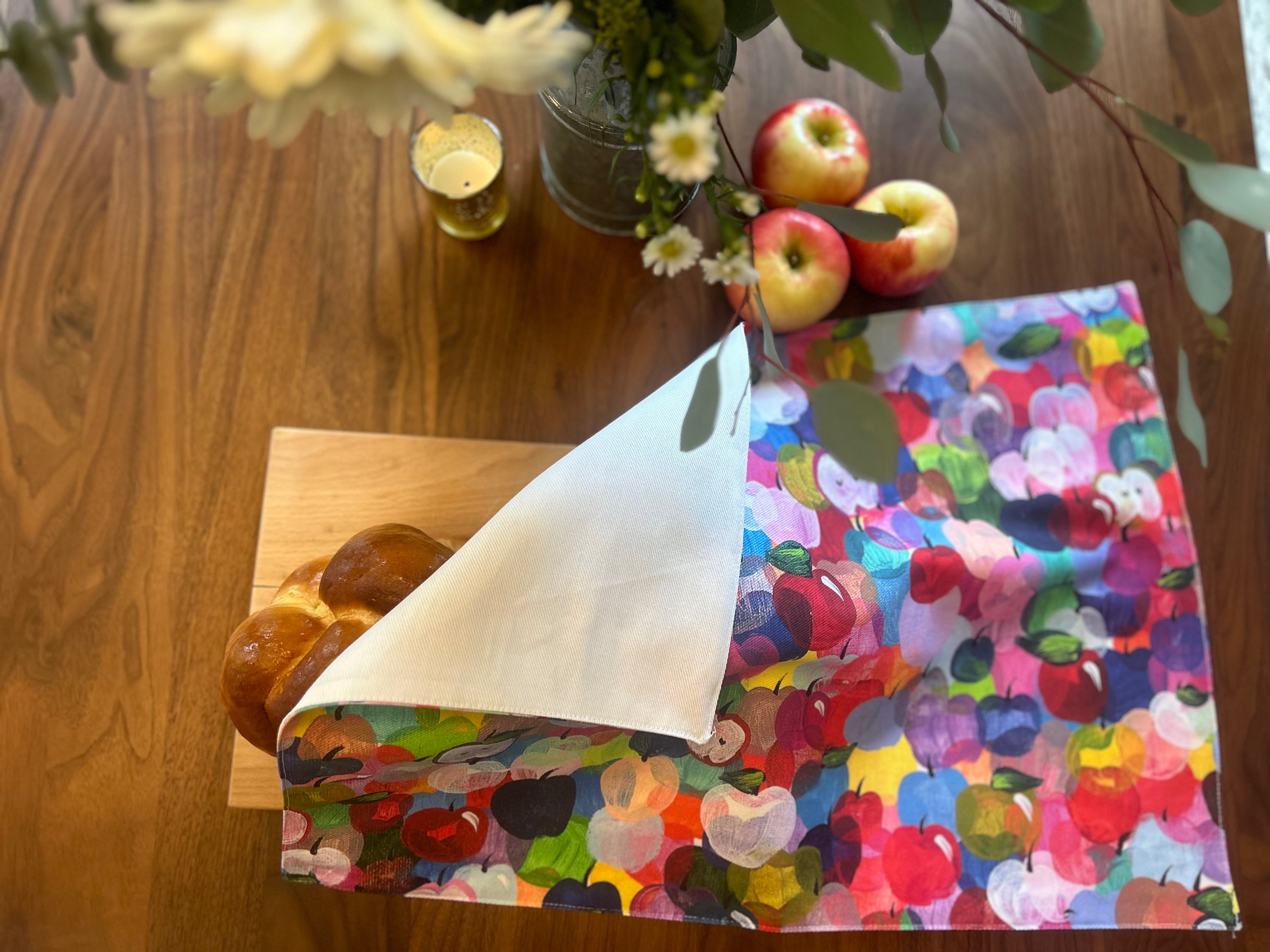 Rainbow Apples Rosh Hashanah challah cover featuring colorful original artwork by Arielle Zorger Designs