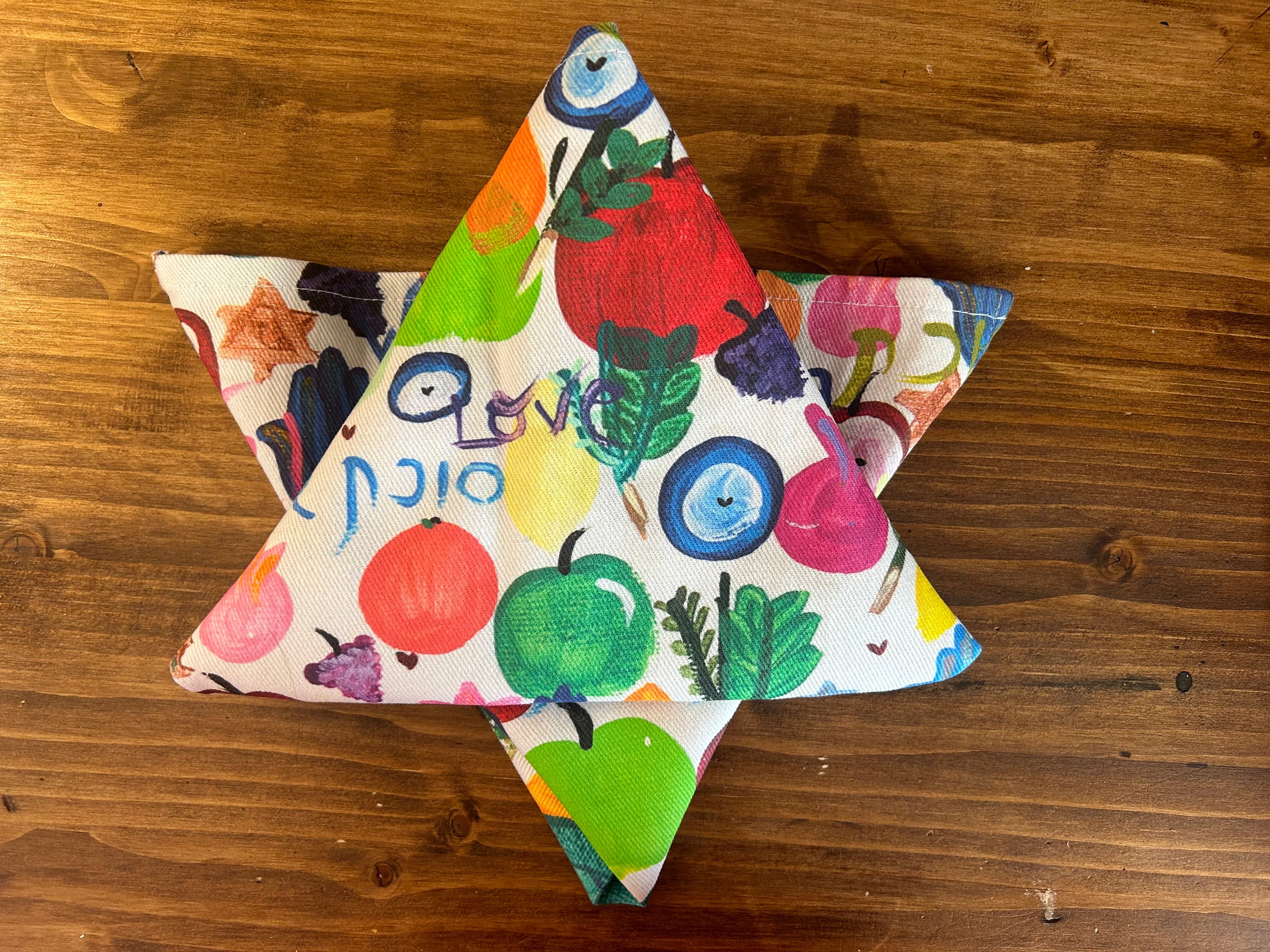 Sukkah Shalom napkins styled for a colorful Sukkot table